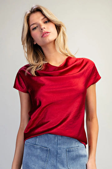 Women's red satin short sleeve top featuring a softly draped cowl neckline and relaxed silhouette.