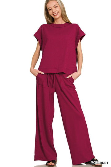 Women’s two-piece ribbed short sleeve tee and matching pants set made from a soft stretch cotton blend.