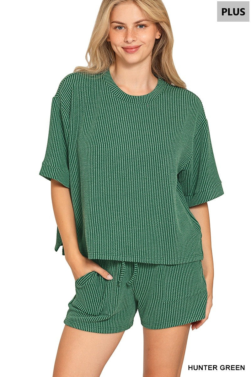 Women’s curvy hunter green two-piece textured short set featuring a relaxed short-sleeve top and matching drawstring shorts with front pockets.