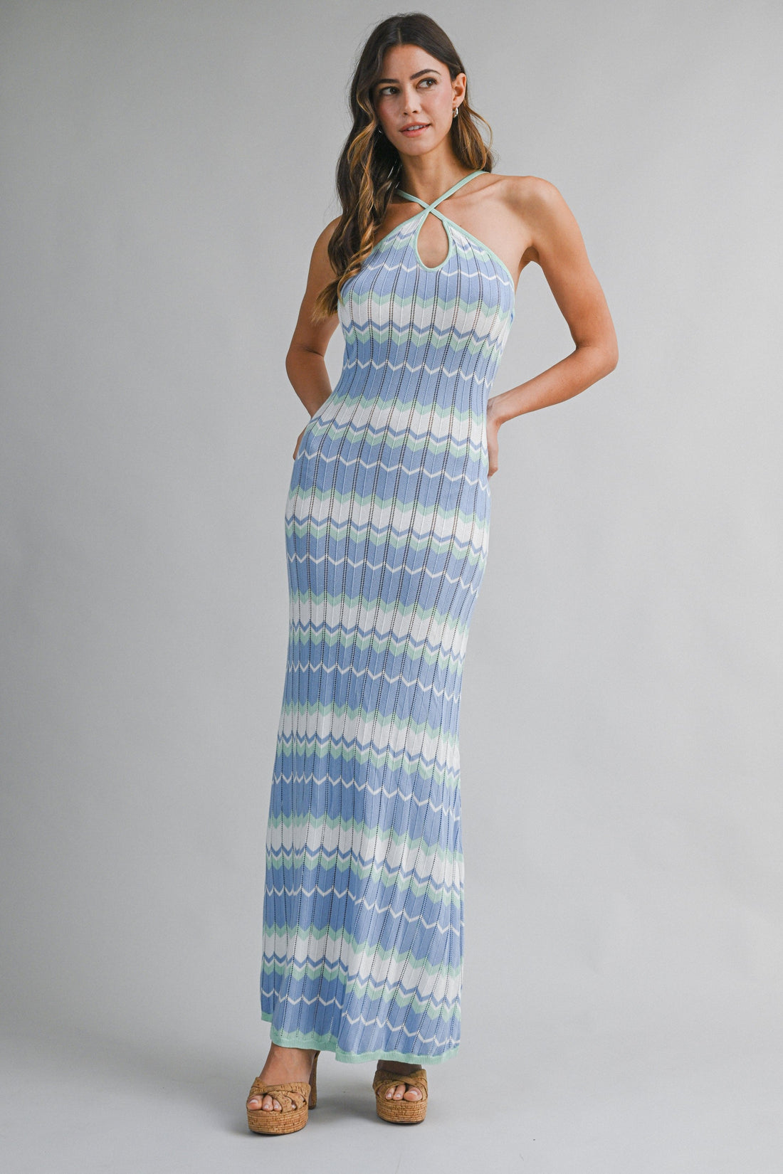 Women's blue halter knit bodycon maxi dress with coastal stripe pattern