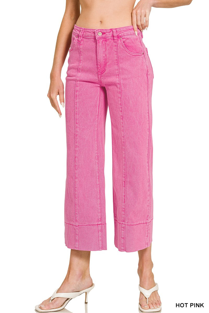 Women’s hot pink cropped wide leg jeans featuring front seam detailing, five-pocket styling and a wide cuffed hem.