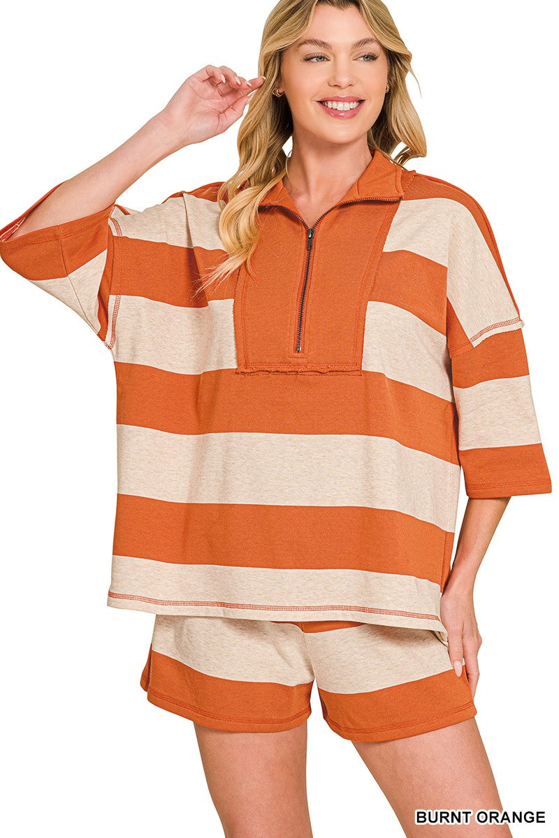 A comfortable burnt orange and grey lounge set with a zipper detailing