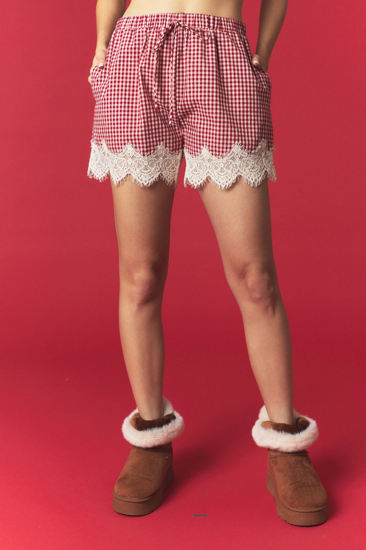 Peach Love California red and white mini gingham cotton shorts featuring an elastic drawstring waistband, side pockets, and delicate ivory scalloped floral lace trim along the hems.