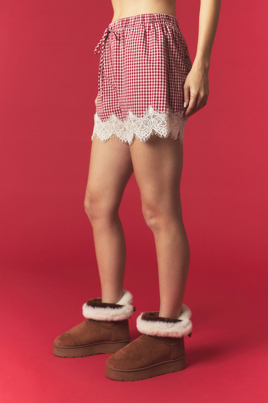 Peach Love California red and white mini gingham cotton shorts featuring an elastic drawstring waistband, side pockets, and delicate ivory scalloped floral lace trim along the hems.