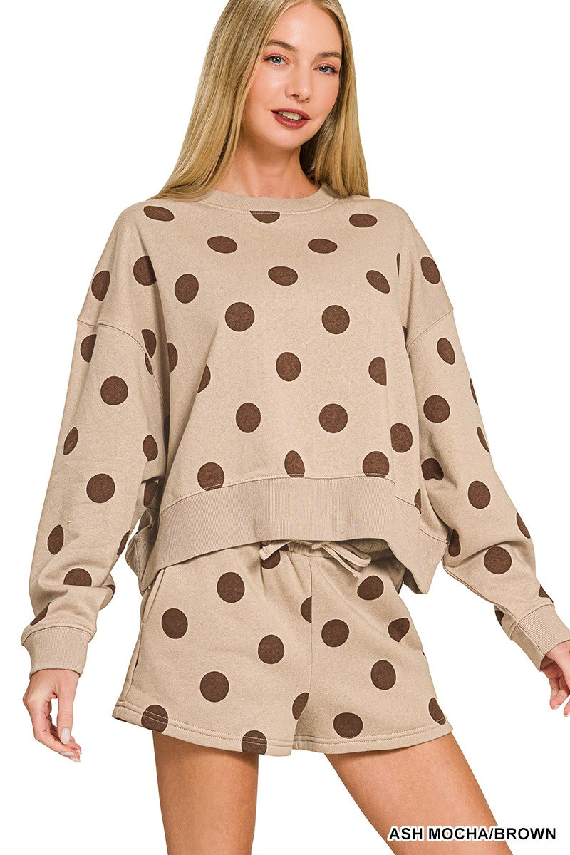 Women’s polka dot fleece two-piece set featuring a round neck pullover and coordinating shorts.
