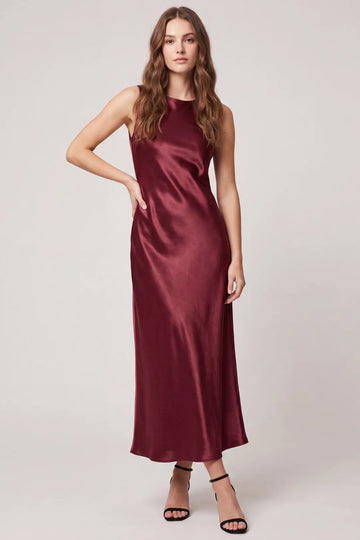 Women's burgundy satin maxi dress featuring a sleeveless silhouette, classic round neckline, flowing ankle-length skirt, and elegant draped cowl back, perfect for weddings and special occasions.