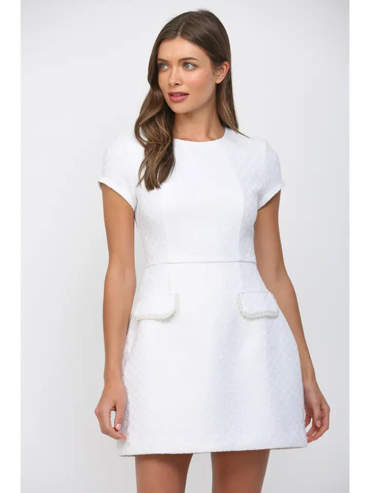 White tweed mini dress with bead trim and front flap pockets