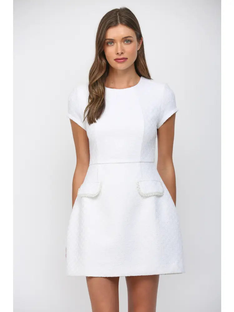 White tweed mini dress with bead trim and front flap pockets