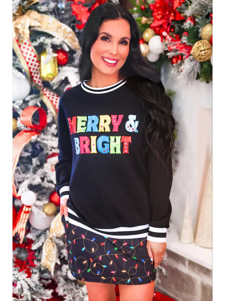 Jess Lea Merry & Bright Christmas pullover featuring festive foil letter patches and a comfortable relaxed silhouette.