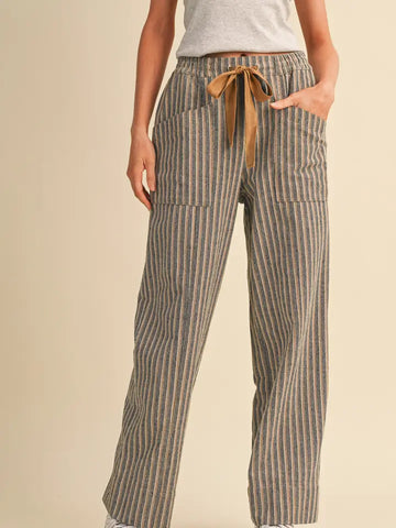 Women’s striped high-rise wide leg pants featuring a covered elastic waistband, contrast drawstring and front and back patch pockets.