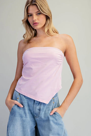 Women's blush pink strapless fitted top with a straight neckline and asymmetrical pointed hem.