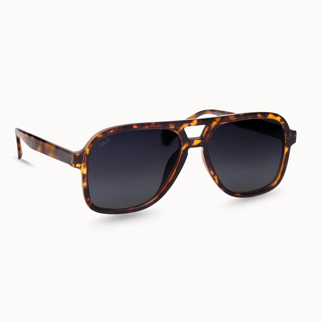 Tortoise-patterned sunglasses with dark polarized lenses, sporty aviator style, made of durable plastic for women on the go.