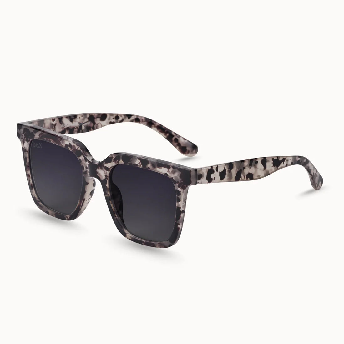 Dax sunglasses with a bold, oversized frame featuring a grey cheetah print and dark gradient lenses, perfect for stylish sun protection.