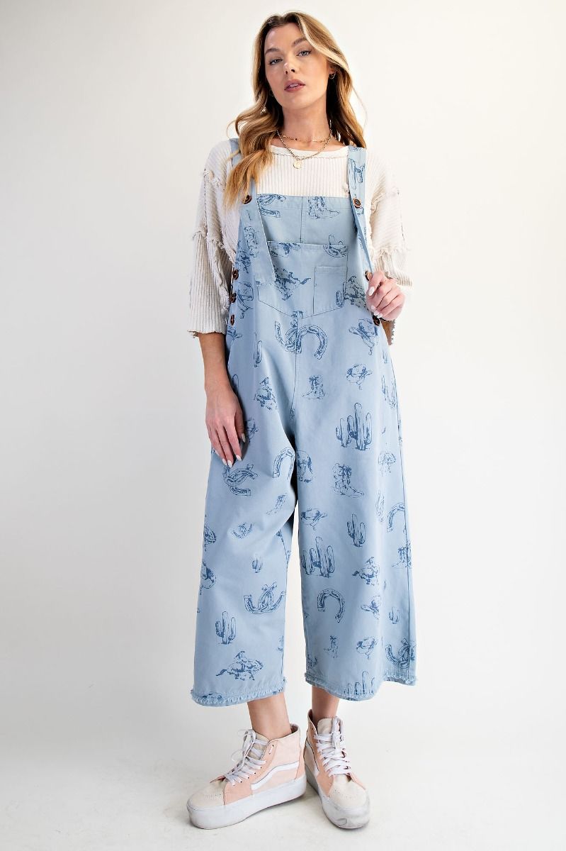 Blue western overalls by easel