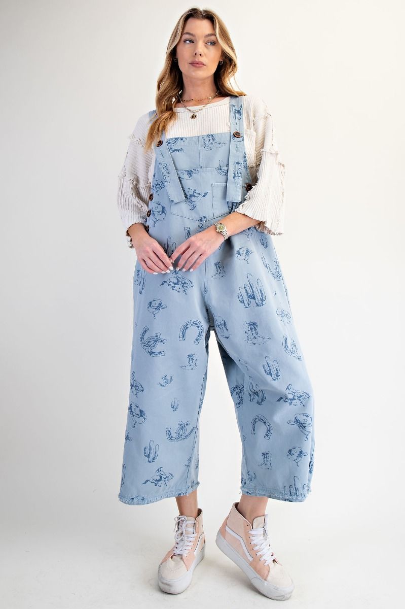 Blue western overalls by easel