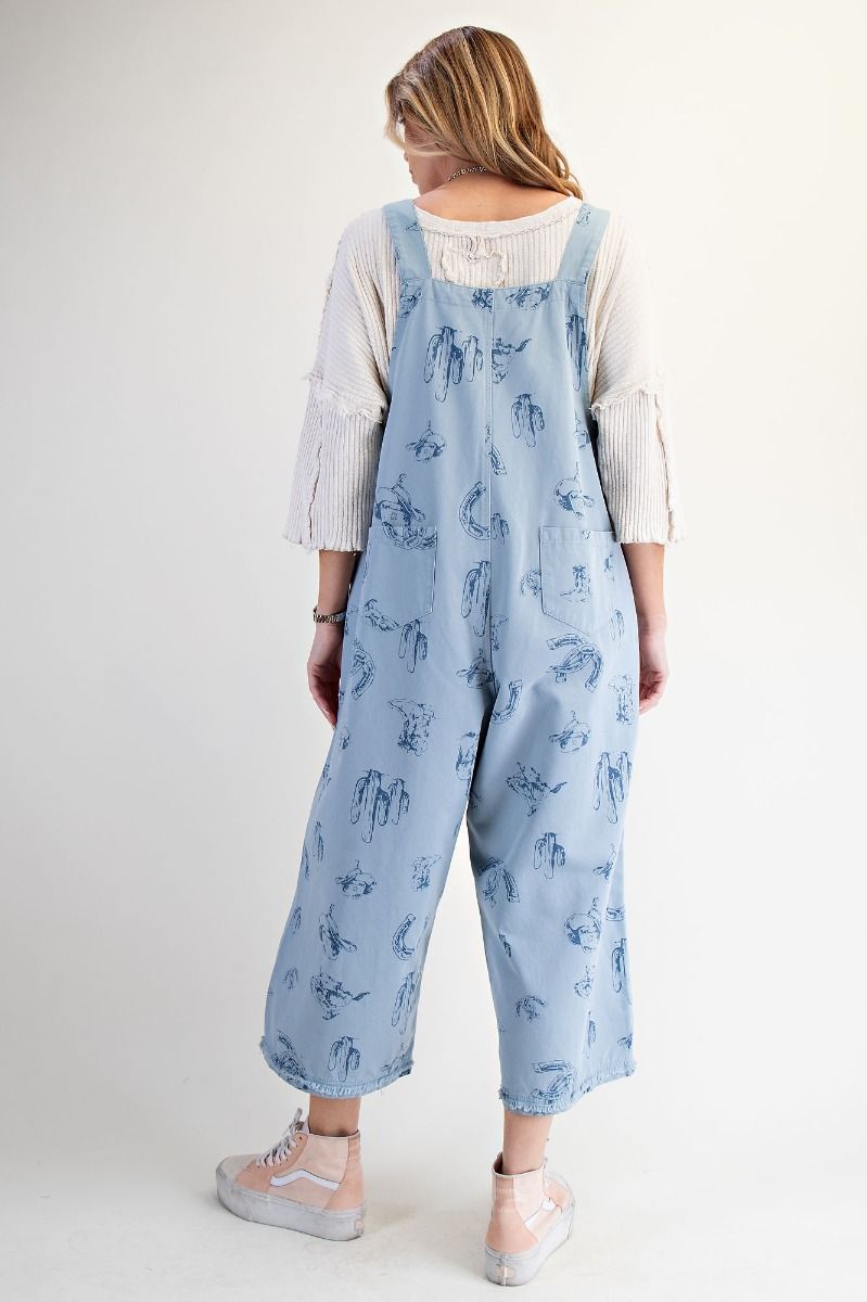 Blue western overalls by easel