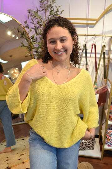 Butter yellow lightweight net sweater with a relaxed fit and wide neck line