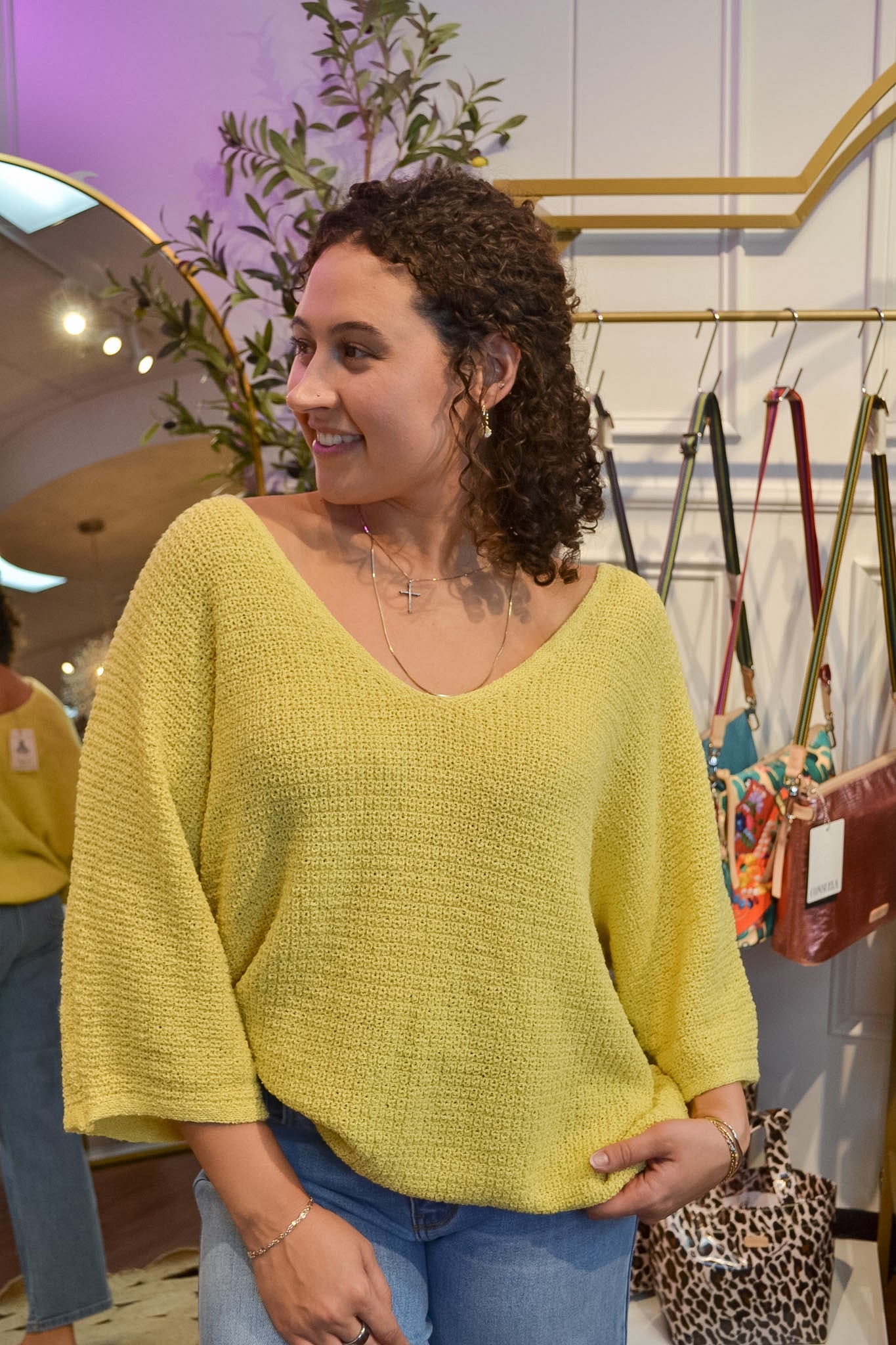 Women’s yellow textured knit top featuring a loose fit and floaty, three-quarter sleeves