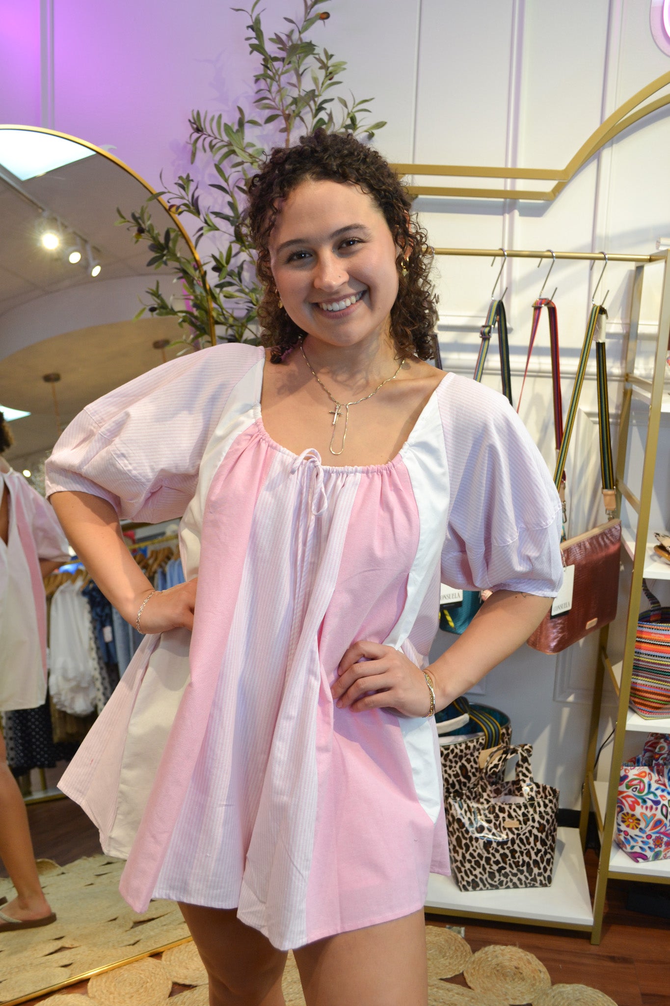 Women’s pink and white oversized babydoll romper with short puff sleeves and flowy silhouette