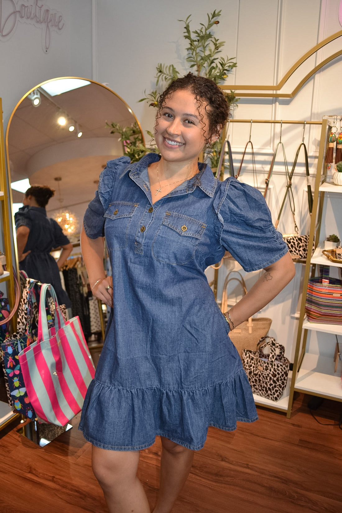 Denim dress with a ruffle hem and gold button detailing 