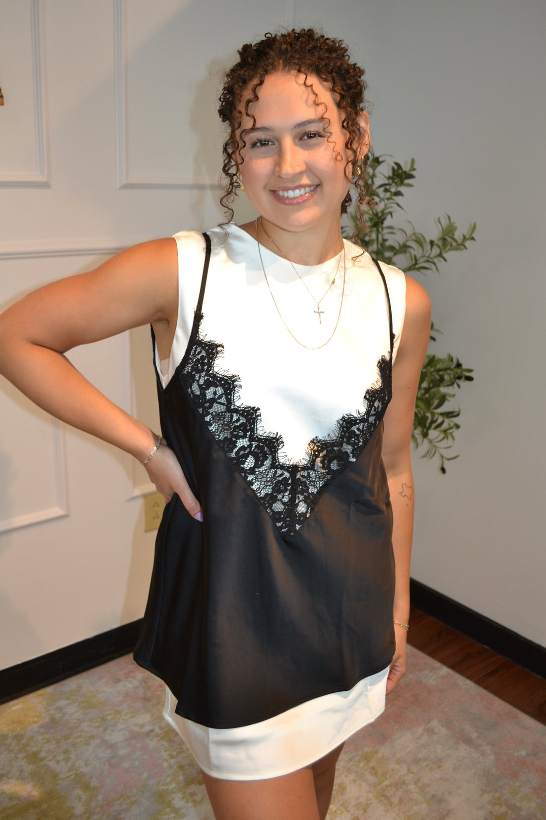 Elegant black and ivory layered mini dress featuring a lace-trim slip overlay, adjustable spaghetti straps, keyhole back, and a relaxed fit. Perfect for date nights, parties, and special occasions.
