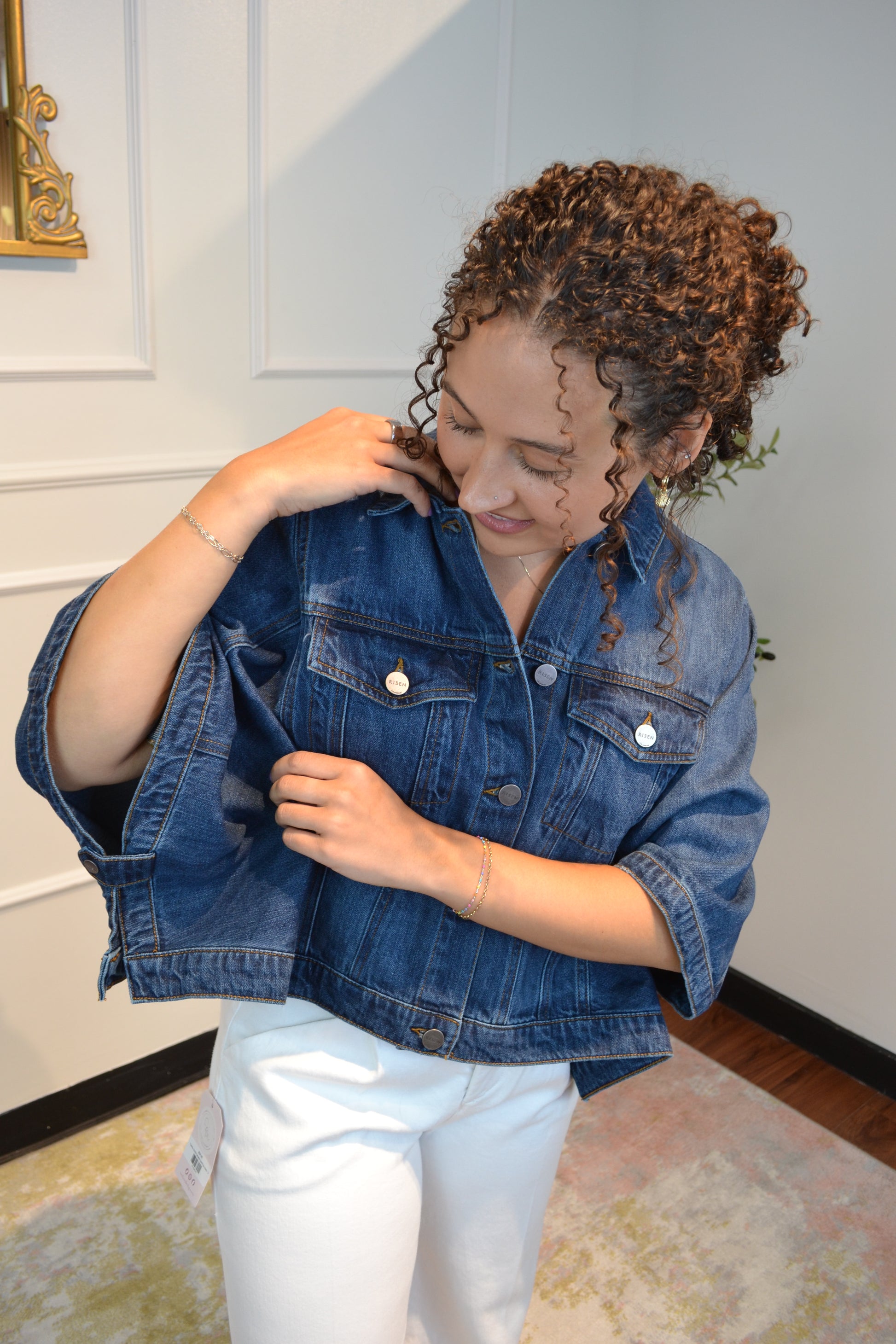 Oversized blue denim jacket featuring a relaxed silhouette and classic button-front design.