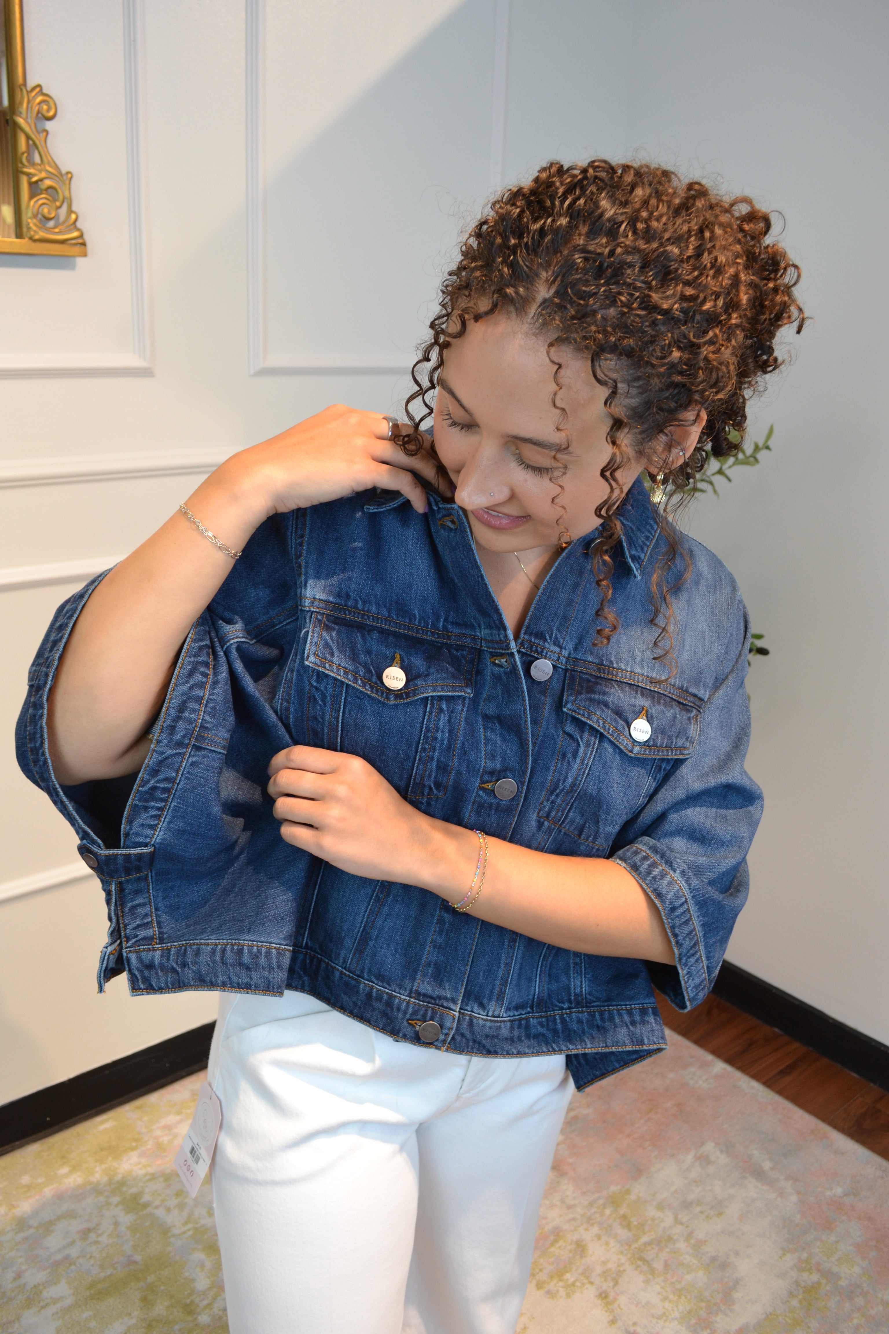 Oversized blue denim jacket featuring a relaxed silhouette and classic button-front design.