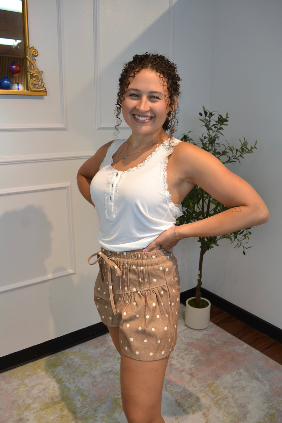 Women's mocha polka dot high-waisted paperbag shorts with tie waist.
