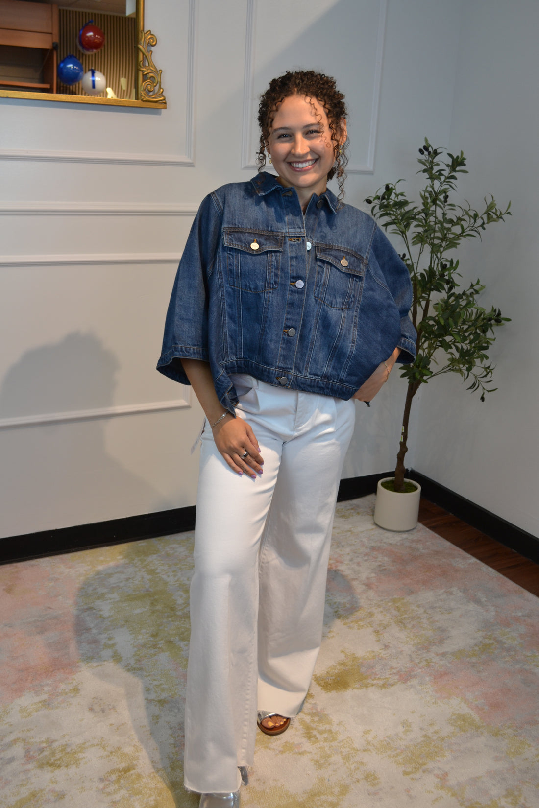 Dark wash oversized cropped denim jacket styled with white jeans for a casual chic outfit.
