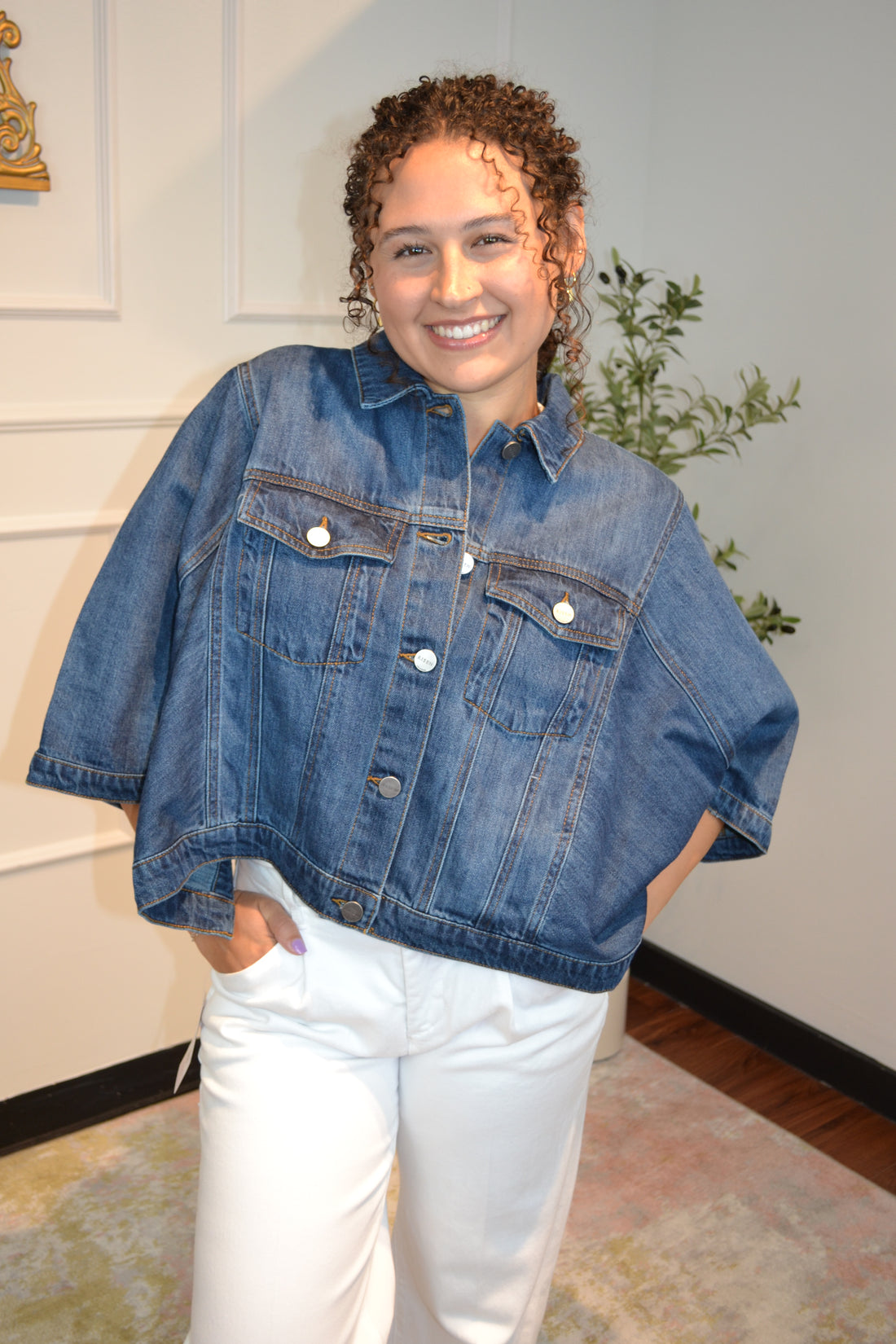 Dark wash oversized cropped denim jacket styled with white jeans for a casual chic outfit.