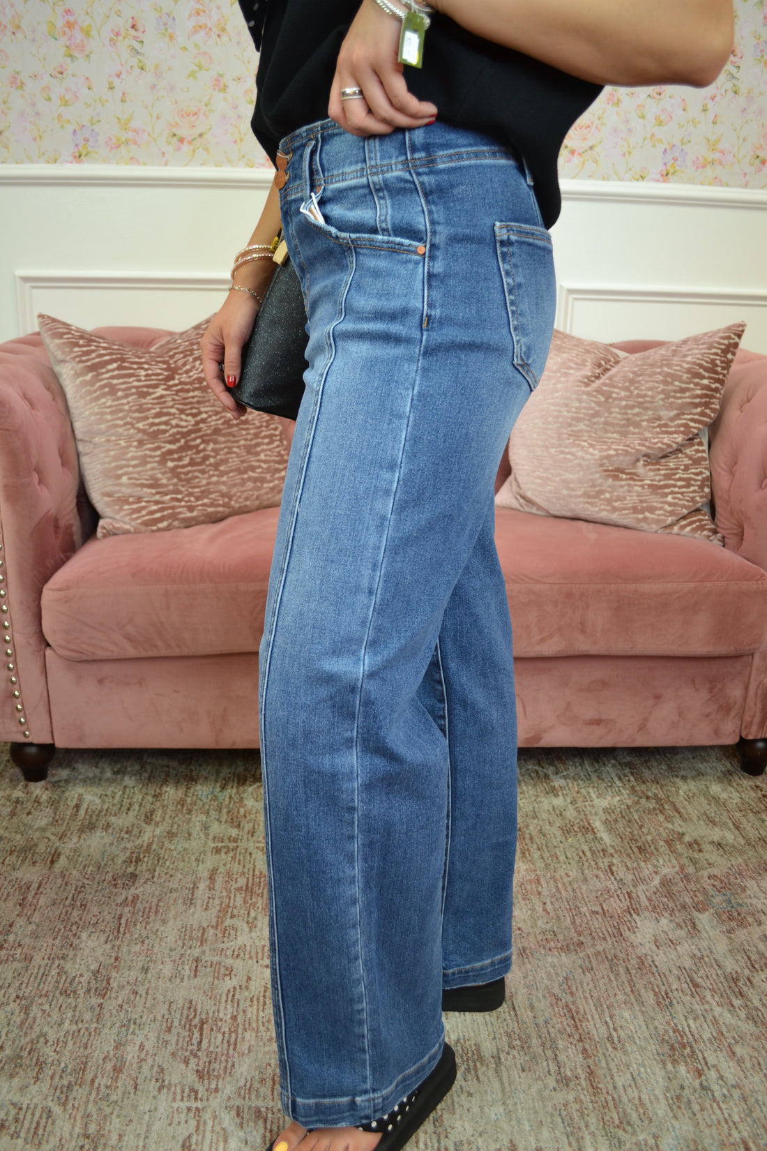 Classic medium wash high-rise straight-leg jeans featuring a flattering double-button waistband, stretch denim, and a timeless silhouette perfect for everyday wear.
