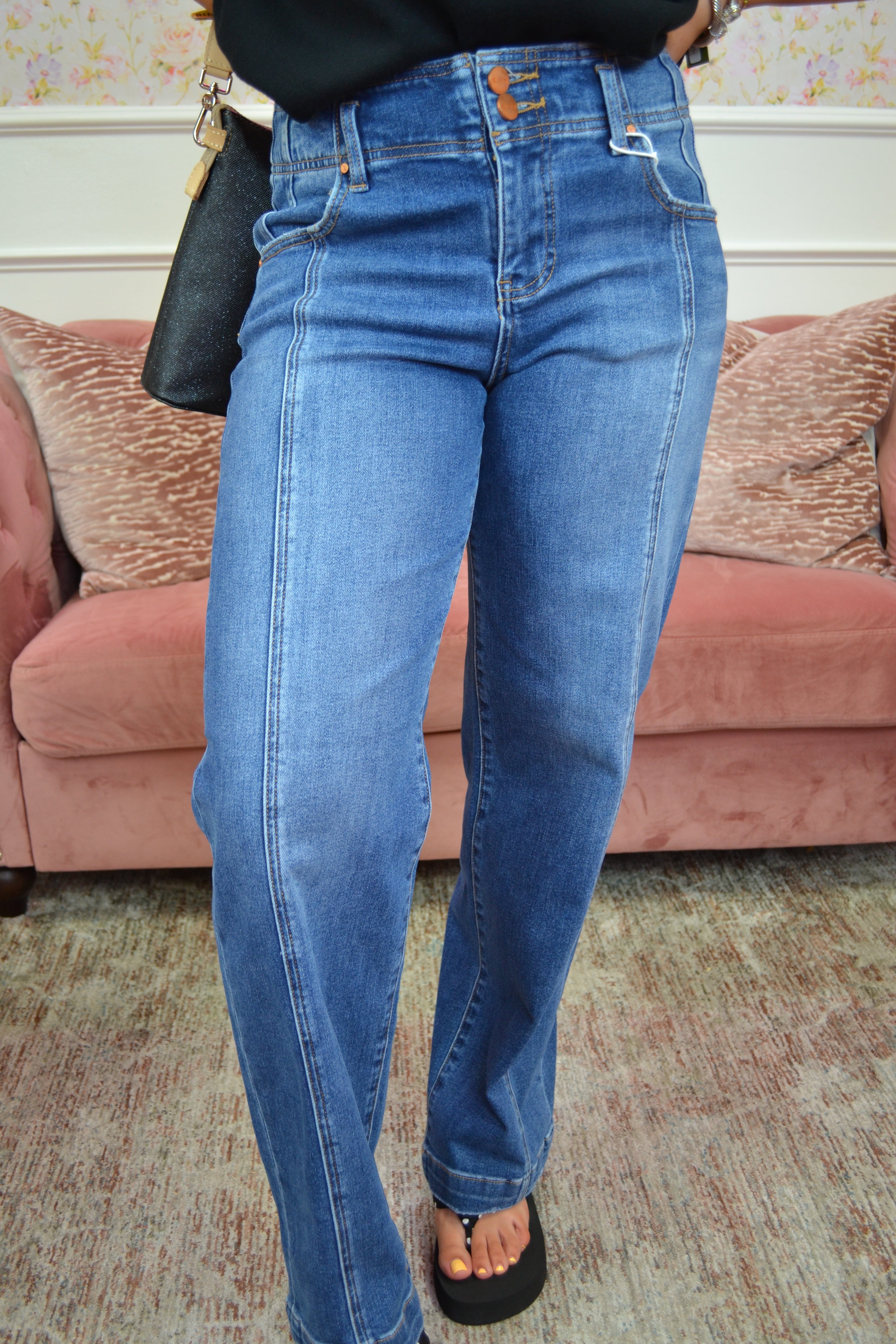 Flattering high-rise waist, stylish double-button waistband, and soft stretch denim for all-day comfort