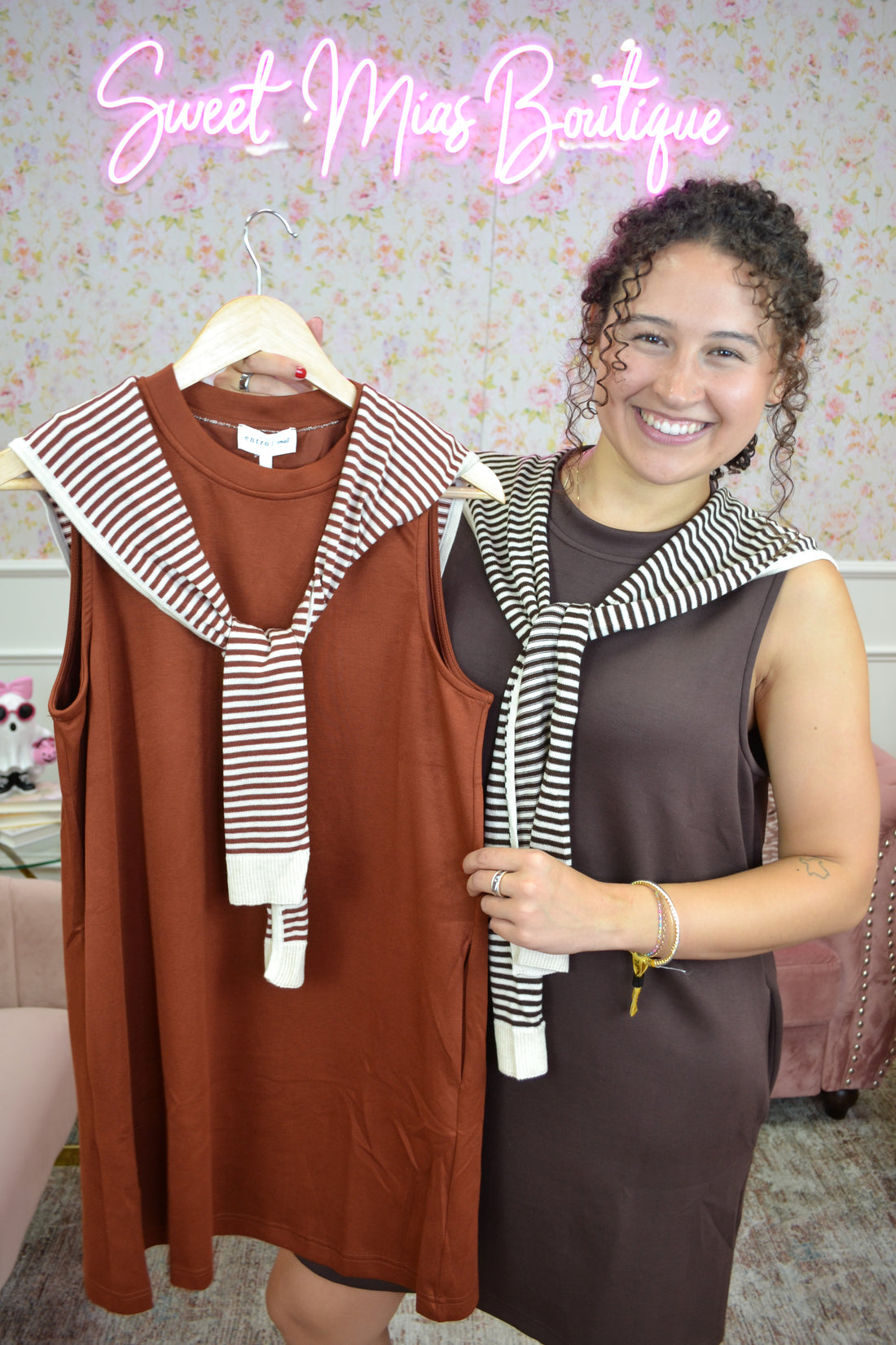 Brown sleeveless knit mini dress with attached striped sweater detail and relaxed fit for casual everyday style.