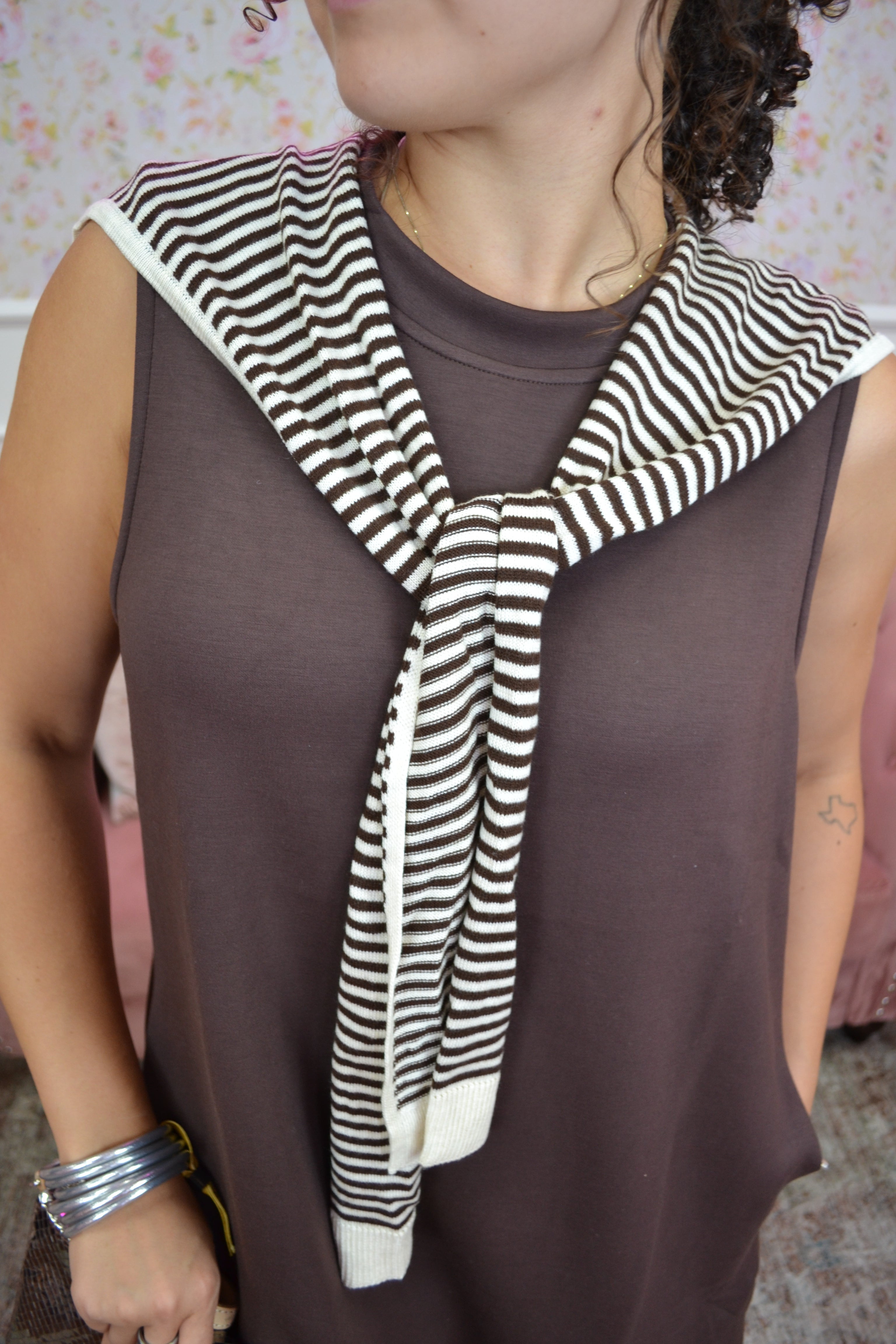 Trendy sleeveless brown mini dress with built-in striped sweater scarf accent.