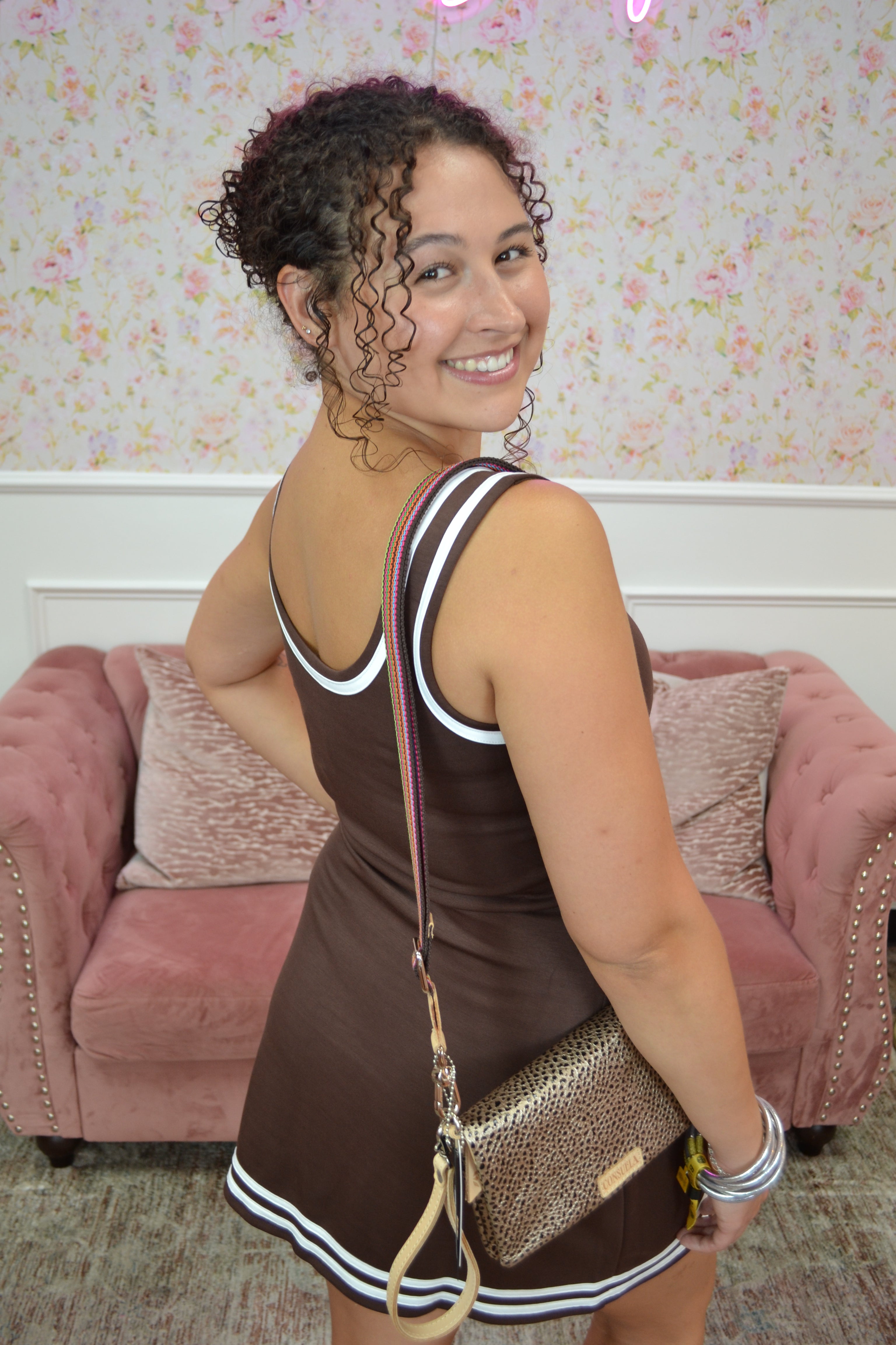 Brown activewear mini dress with contrast trim and built-in romper shorts