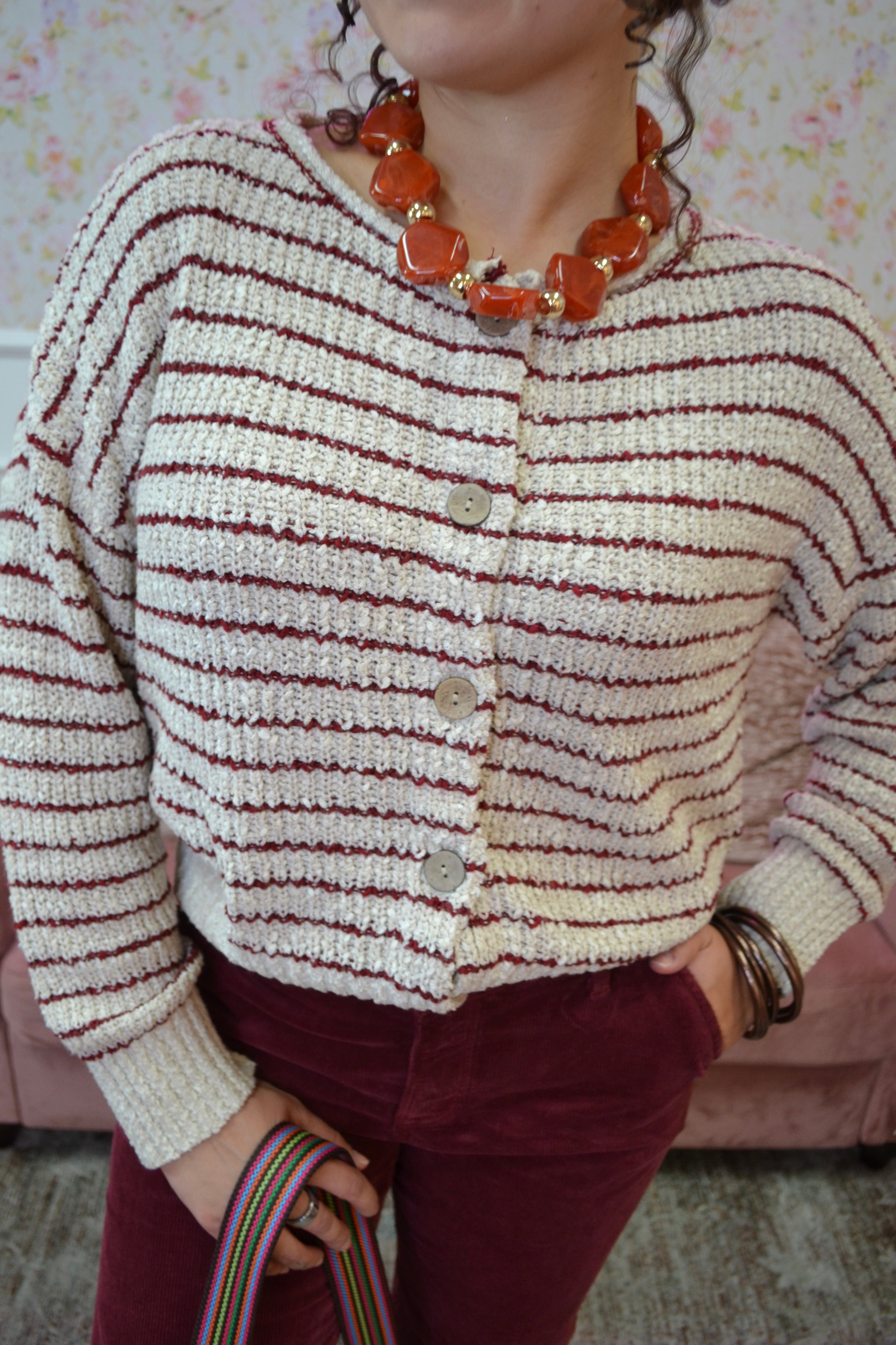 striped knit cardigan featuring wooden buttons, a V-neckline, and lightweight knit fabric.