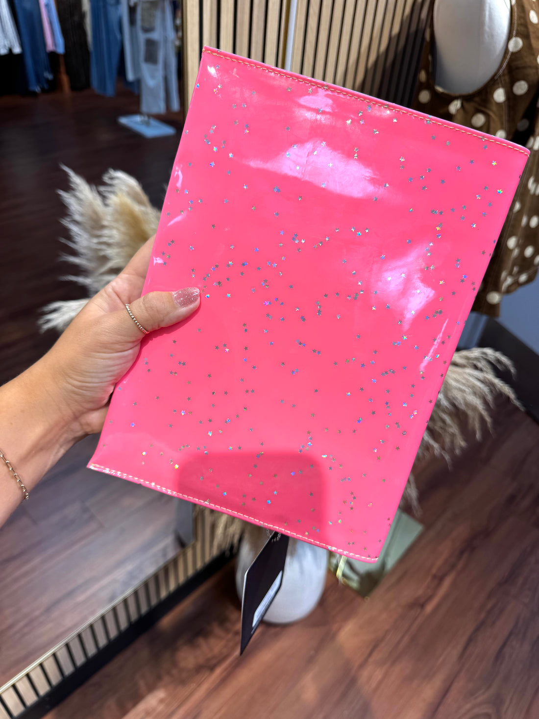 Consuela Shine Notebook Cover in neon pink star glitter with gold leather logo detail