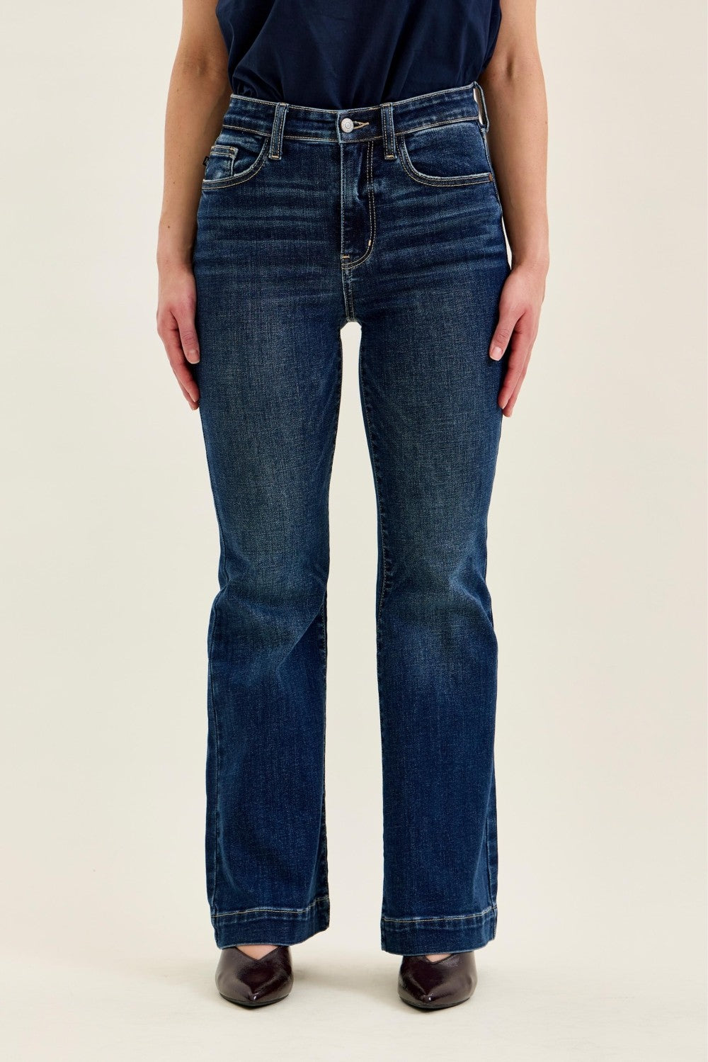 Dark wash high-rise Judy Blue petite flare jeans with 30-inch inseam, classic five-pocket design, and comfortable stretch denim