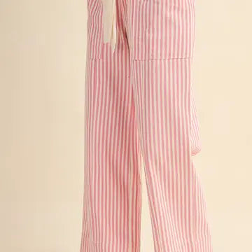 Pink and white vertically striped wide-leg pants with a white drawstring waist, shown on a plain beige background.