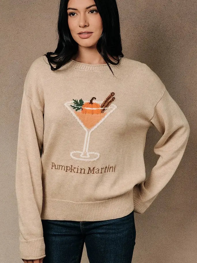Women’s neutral Pumpkin Martini graphic knit sweater featuring a cocktail glass with pumpkin and cinnamon details, crew neckline, and long sleeves