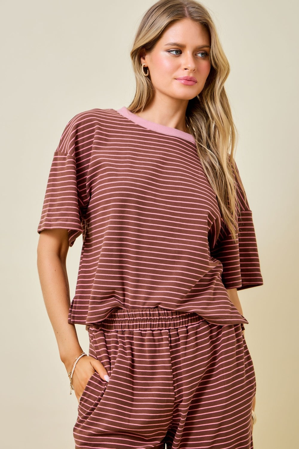 Women's brown and pink striped short sleeve top with relaxed fit and contrast crew neckline