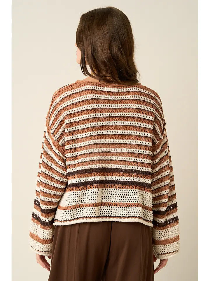 Back view of striped crochet knit sweater with multicolor brown, cream, and black horizontal stripes, relaxed fit, cozy fall look