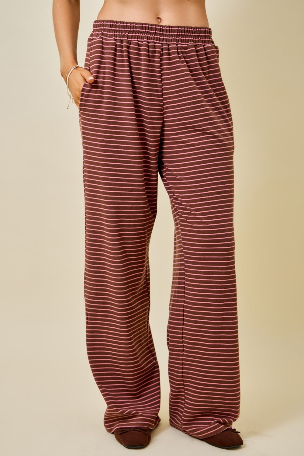 Women's chocolate brown and pink striped wide leg pants with elastic waistband and side pockets