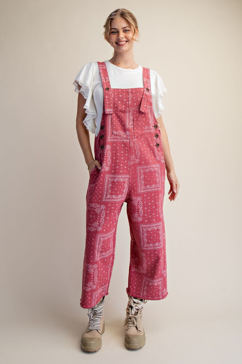 Plus size pink mineral washed cotton twill overalls featuring an all-over white bandana print, relaxed straight legs, cropped length and oversized pockets.