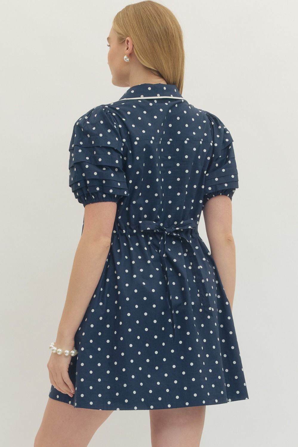 navy polka dot mini dress puff sleeve back view waist tie