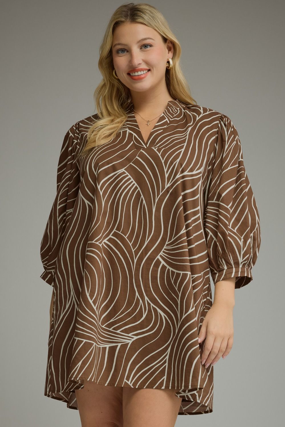Plus-size brown dress with abstract leaf-inspired white print, puff sleeves, split neckline, lightweight woven cotton, SKU: 12345