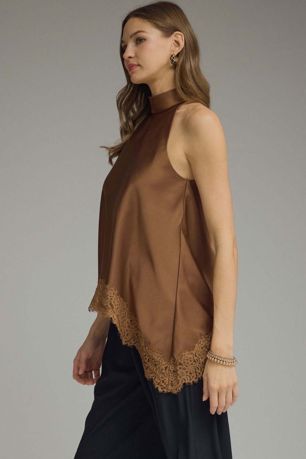 Women’s satin halter blouse featuring a sophisticated high neckline, scalloped lace hem, and flattering relaxed fit.