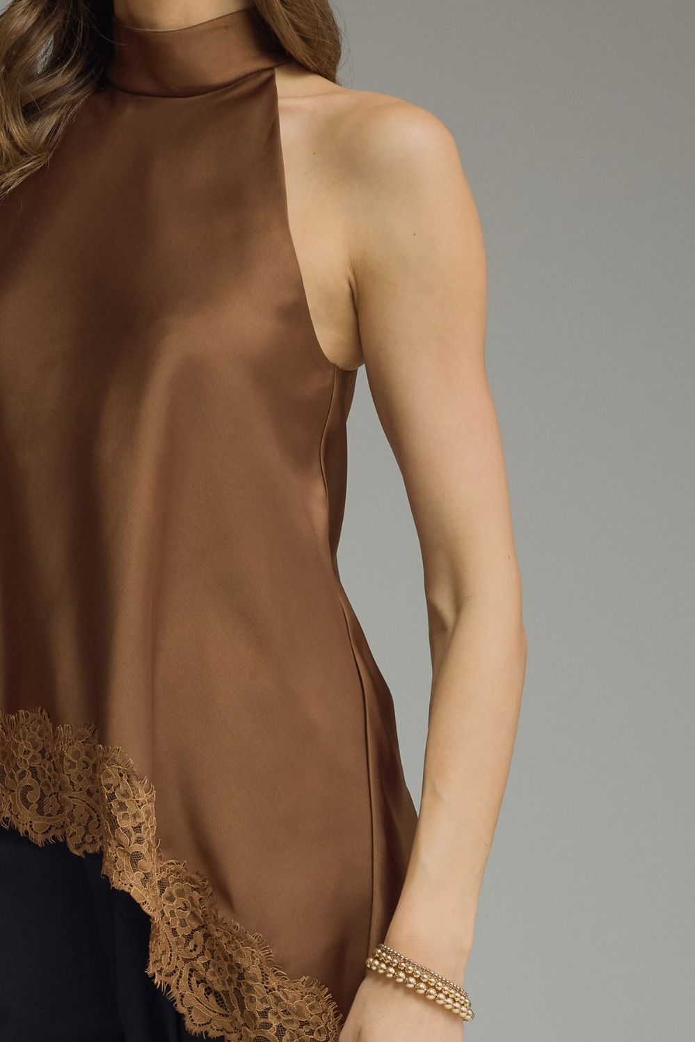 Dressy satin sleeveless top with elegant lace trim and mock neck design available in black, chocolate brown, and burgundy for women.