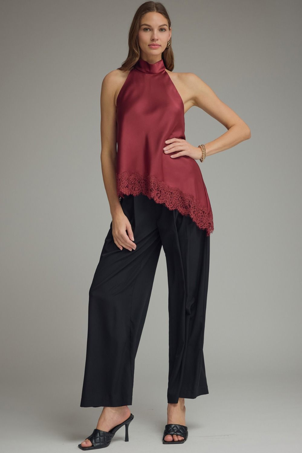  Fashion-forward satin halter blouse with lace hem detailing and elegant mock neck for women’s workwear, evenings, or special events.