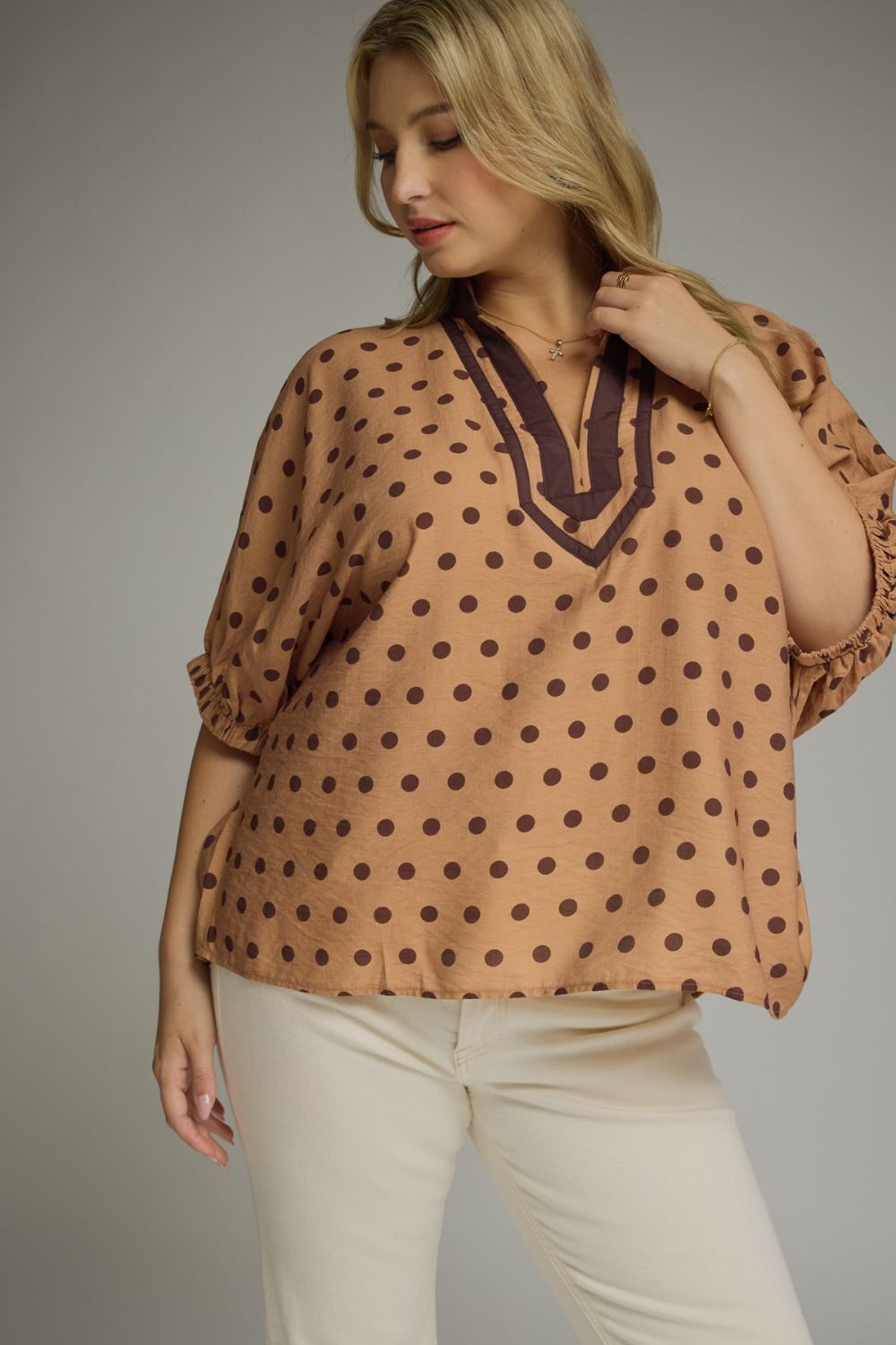 Brown top with chocolate brown polka dot with a v neck neckline 